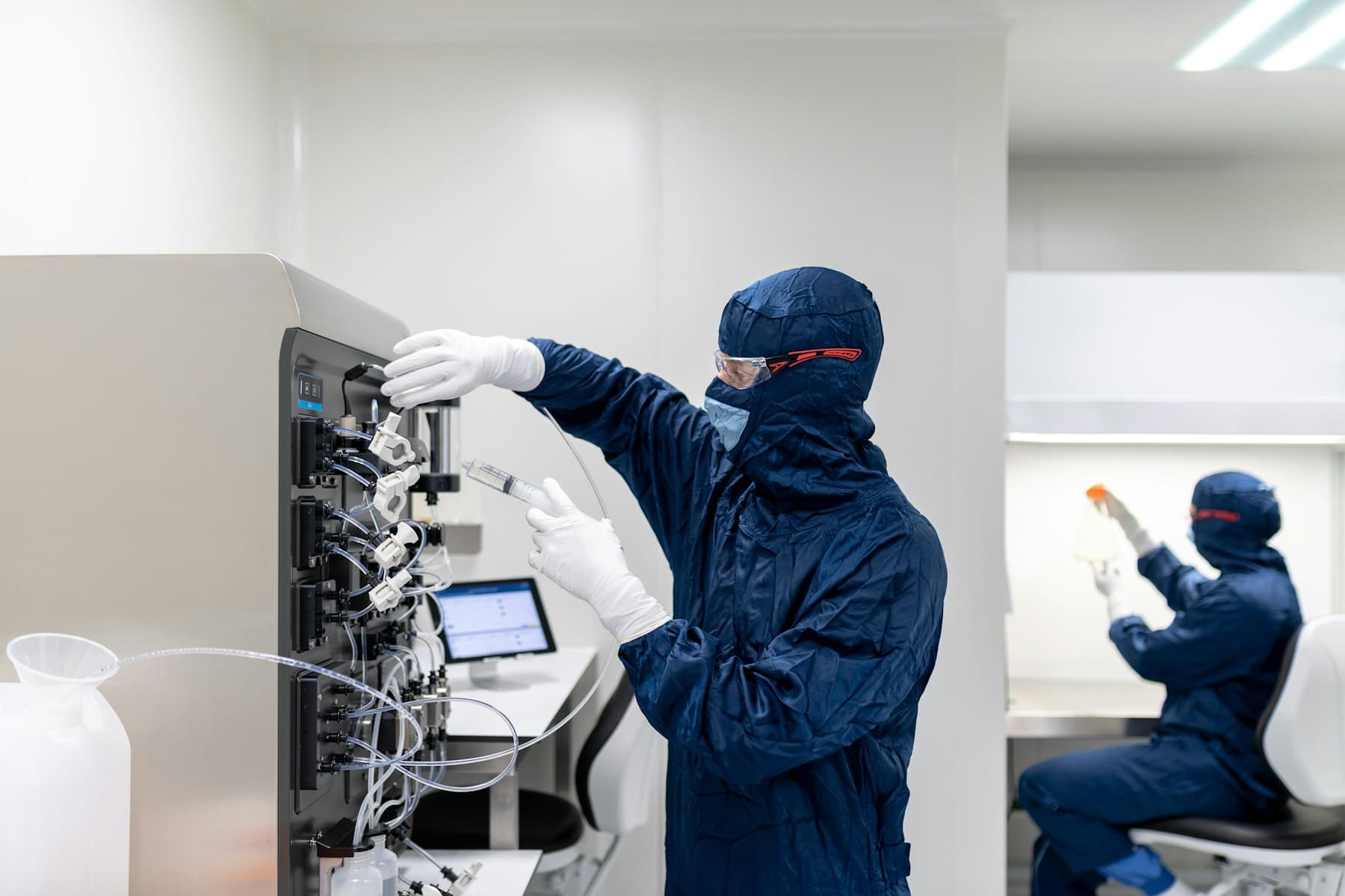 Controlled laboratory team working in a clean-room environment